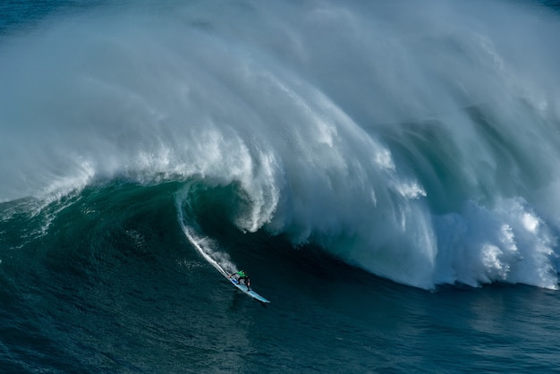 Tall foamy waves of the Atlantic Ocean near the Nazare municipality in Portugal