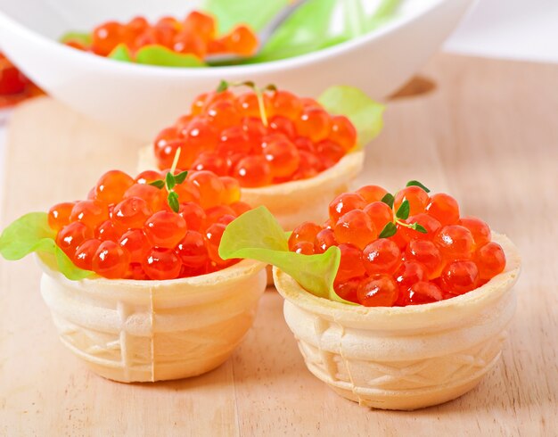 Tartlets with red caviar