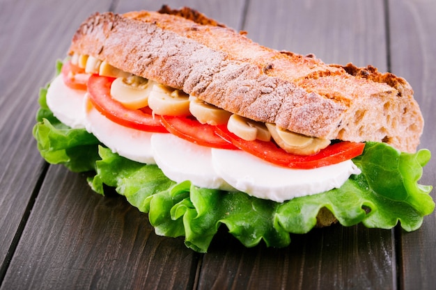 Free Photo tasteful sandwich made of sliced mushrooms, tomatoes, boiled eggs and salad