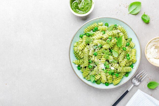 Tasty appetizing pasta with pesto on plate