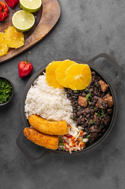 Tasty brazilian dish with orange above view