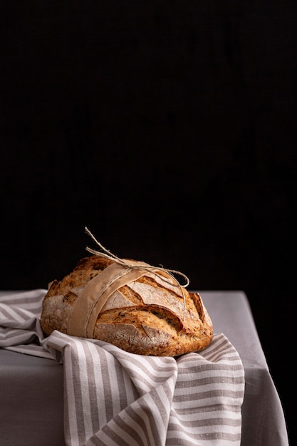 Tasty bread on striped cloth