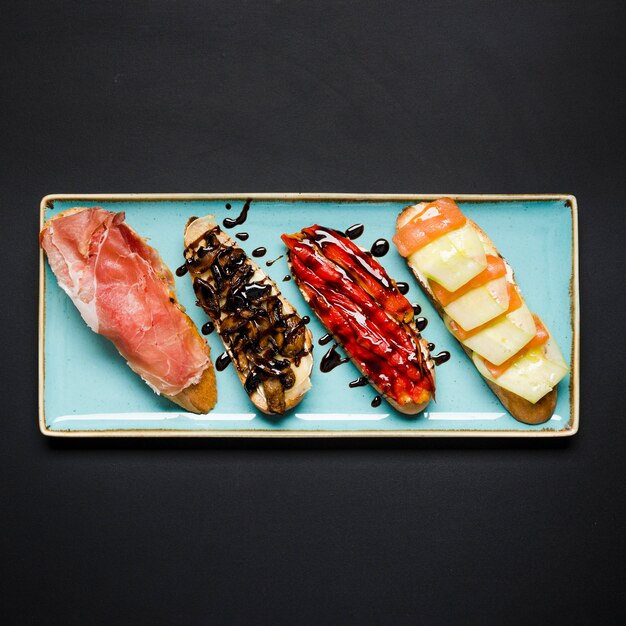 Tasty bruschetta assortment flat lay