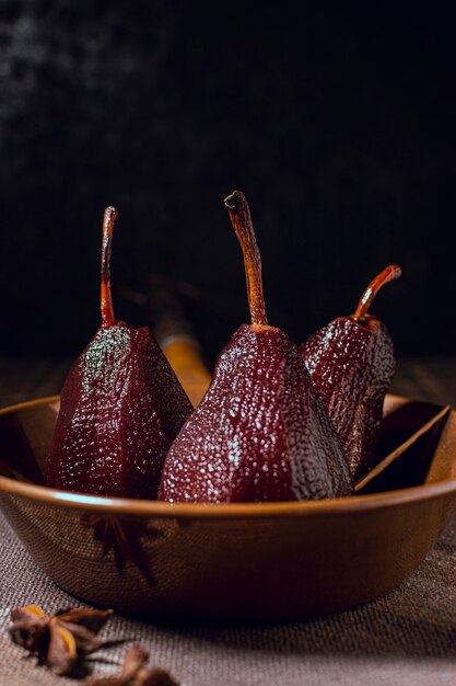 Tasty caramelized pears in bowl close-up