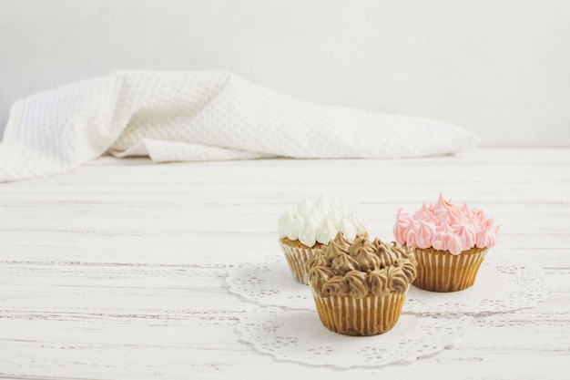 Tasty cupcakes on doilies