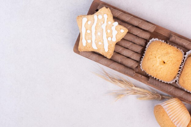 Tasty cupcakes on white table .