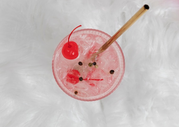 Free photo tasty daiquiri cocktail with cherry flat lay