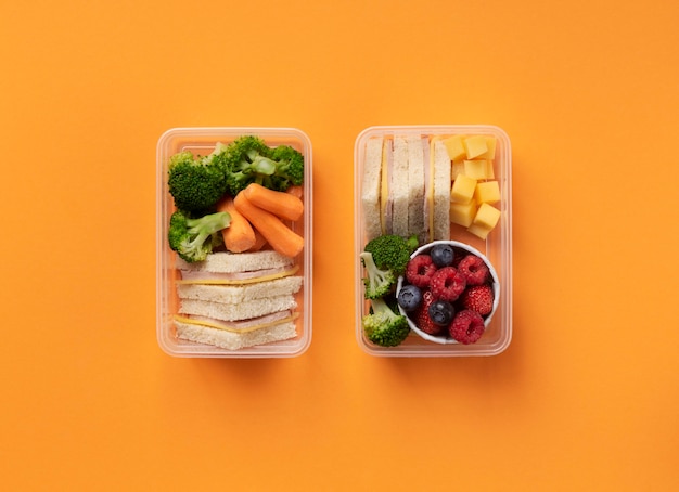 Tasty food lunch boxes arrangement top view