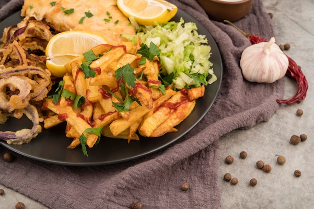 Tasty french fries salad and meat