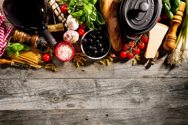 Free Photo tasty fresh appetizing italian food ingredients on old rustic wooden background. ready to cook. home italian healthy food cooking concept. 