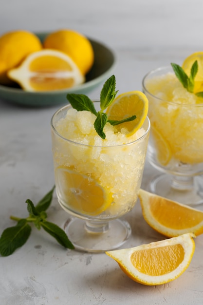 Tasty granita dessert with lemon still life high angle