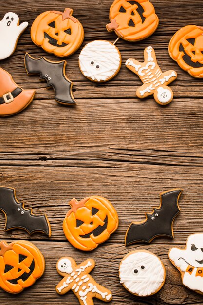 Tasty halloween cookies on wooden table