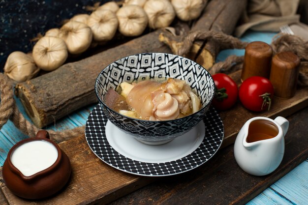 Tasty meat meal with rusk, yogurt and tomato on the table