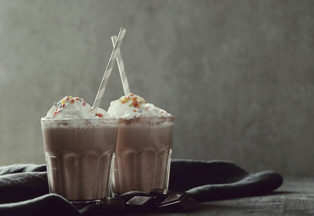 Tasty milkshake drink with straw