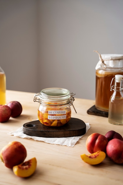 Free Photo tasty nectarine kombucha jar with label