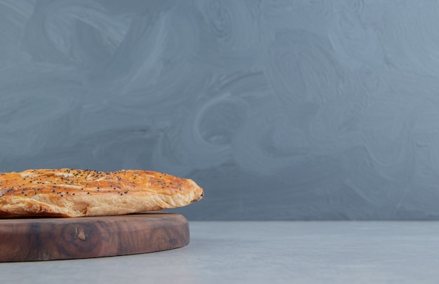 Tasty puff pastry on wooden board. 