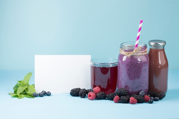 Free photo tasty purple fruit and juices with copy space