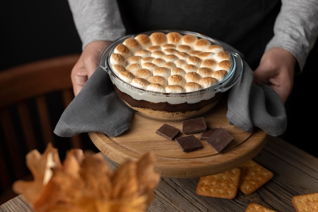 Tasty s'mores dessert on table