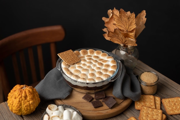 Tasty s'mores dessert on table