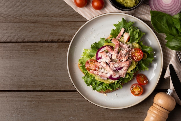 Tasty sandwich on wooden table top view