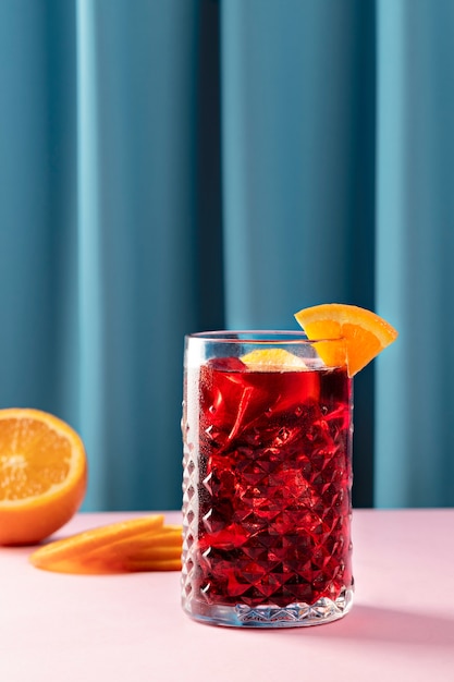 Free Photo tasty sangria with orange slices on pink table