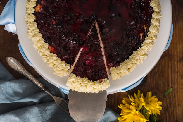 Tasty slice of cake flat lay