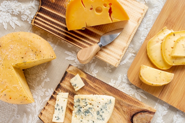 Tasty slices of cheese and brie on a table