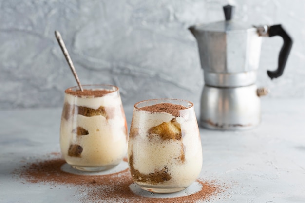 Tasty tiramisu cake in glasses