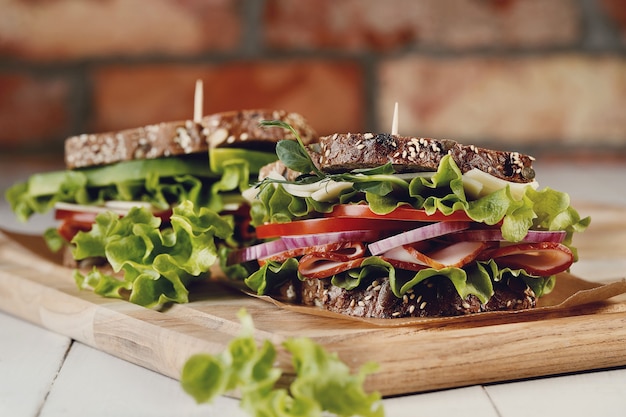 Tasty vegan sandwich over wooden table