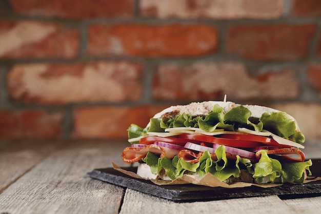 Free photo tasty vegan sandwich over wooden table