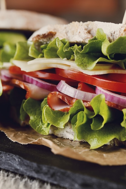 Free photo tasty vegan sandwich over wooden table