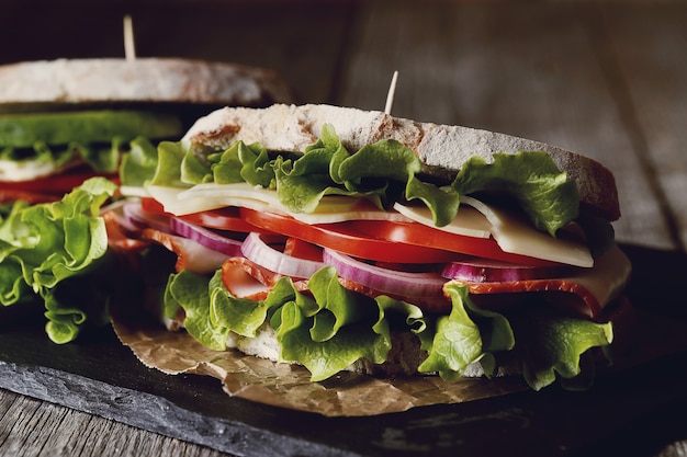 Tasty vegan sandwich over wooden table