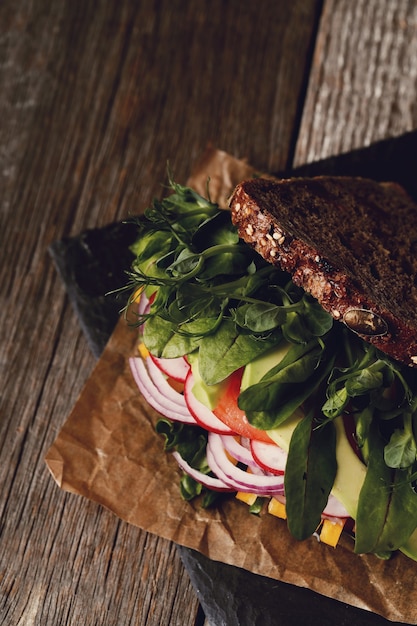 Free photo tasty vegan sandwich over wooden table