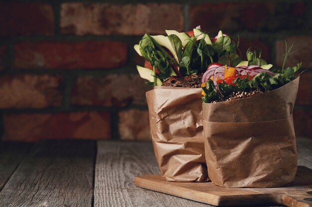 Tasty vegan sandwich over wooden table