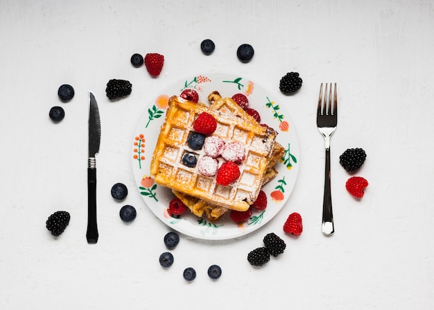 Free photo tasty waffles breakfast with wild berries