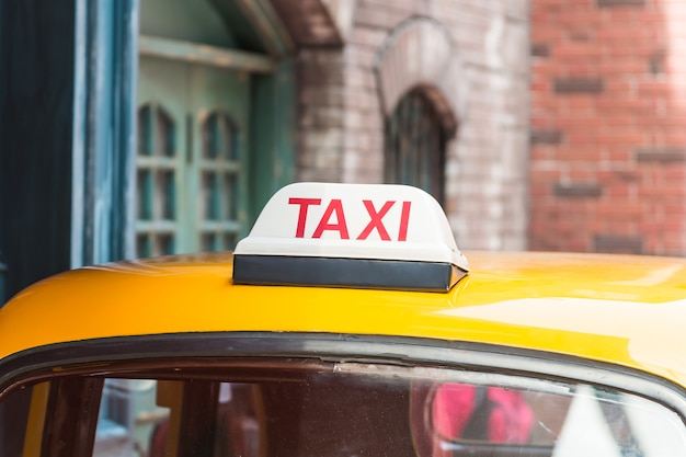 Free Photo taxi sign on roof top car