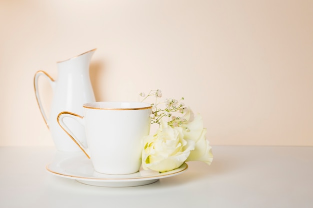 Tea cup and flowers front view