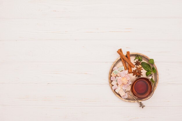 Tea cup with Turkish delight and cinnamon 