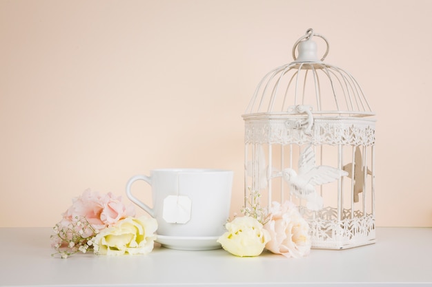 Free Photo tea next to elegant decorations