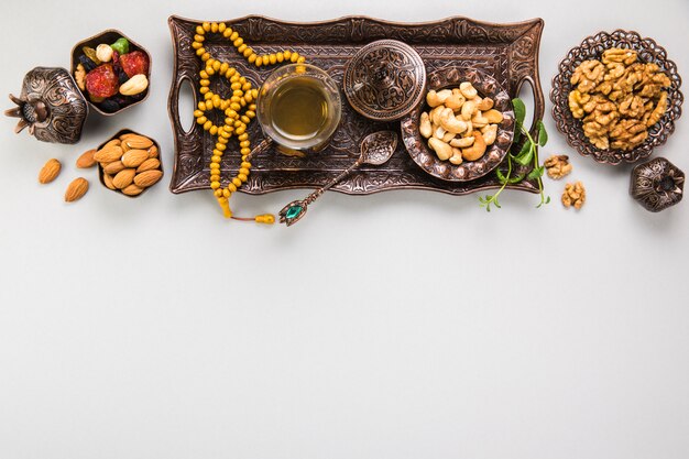 Tea glass with different nuts and beads 