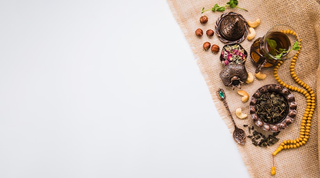 Tea glass with nuts, herbs and beads 