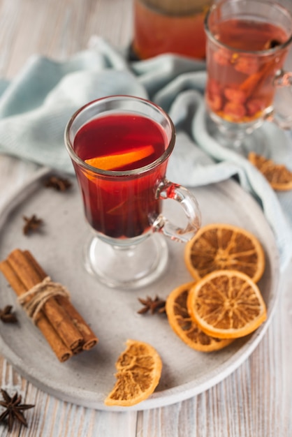 Tea glass with orange slices and anise