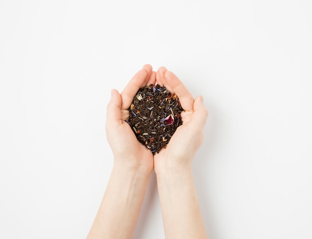 Tea leaves in hand