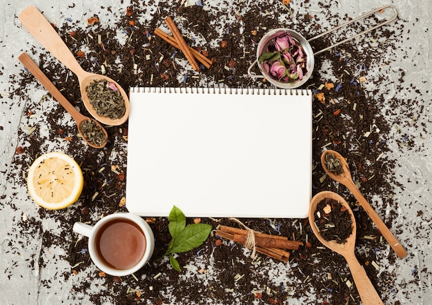 Free Photo tea leaves and notepad template