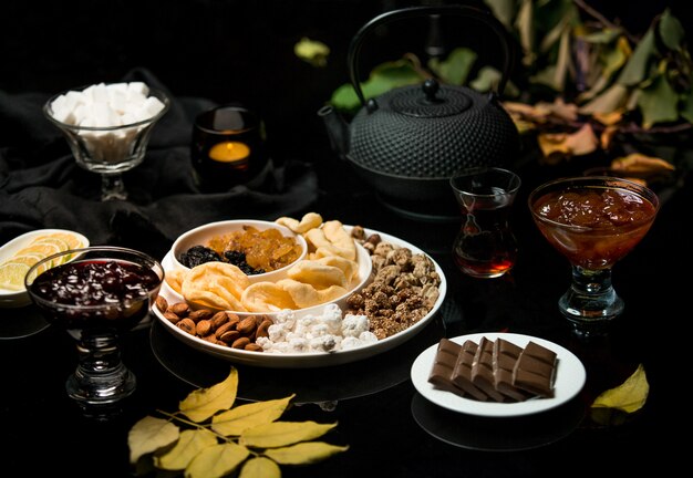 Tea set made of chocolate jam and dried fruits