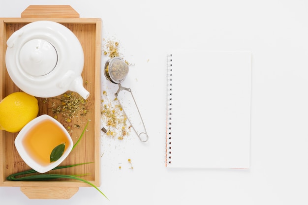 Free photo tea tray with notebook mock-up