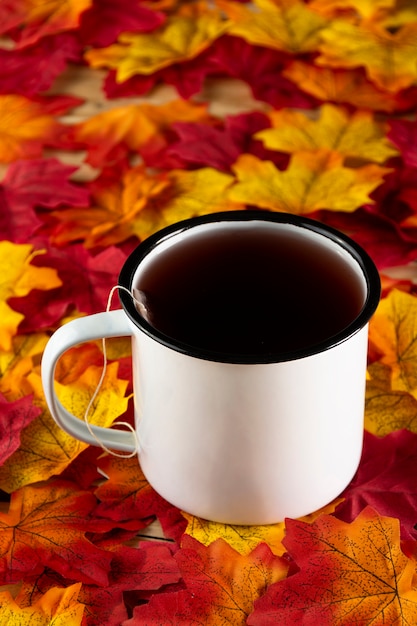 Tea with autumn leaves