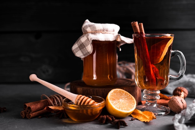 Free photo tea with honey and black background