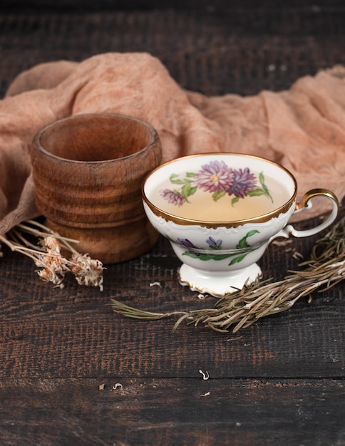 Tea with  lemon and dried flowers on the table