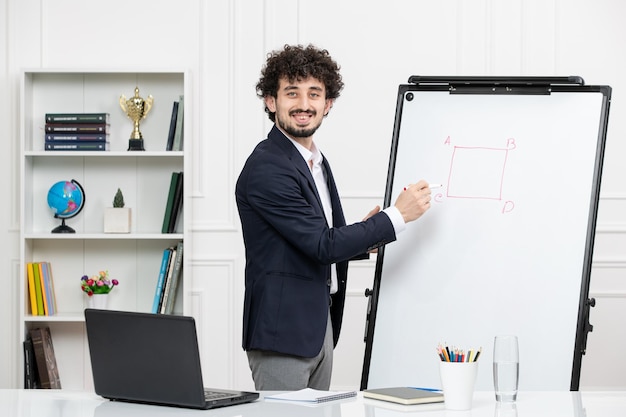 Teacher brunette instructor with computer in suit and whiteboard in classroom explaining lecture